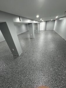 Professional basement epoxy flooring upgrade with moisture control system in Enfield Connecticut