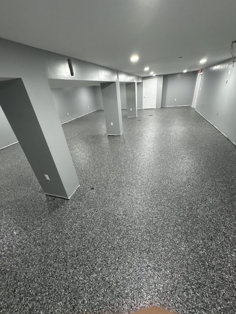 Professional basement epoxy flooring upgrade with moisture control system in Enfield Connecticut